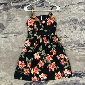 black xhileration dress with flowering pattern